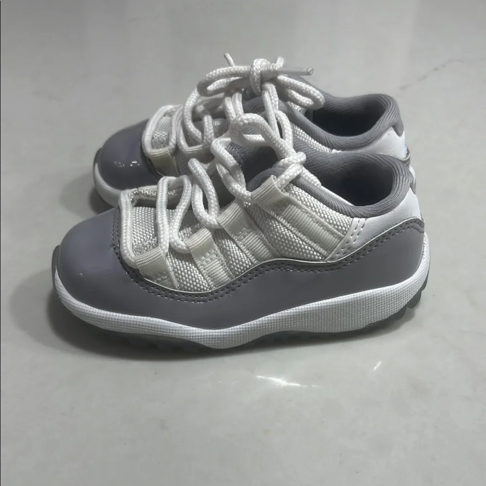 Gray and White Jordan 11 Low Sneakers